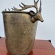 Antique champagne cooler with stag heads