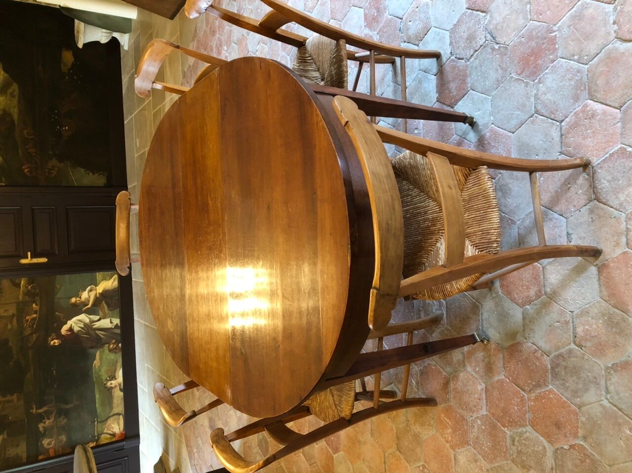 Solid oak table with 3 extension cords, 6 oak chairs with straw seat