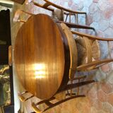 Solid oak table with 3 extension cords, 6 oak chairs with straw seat