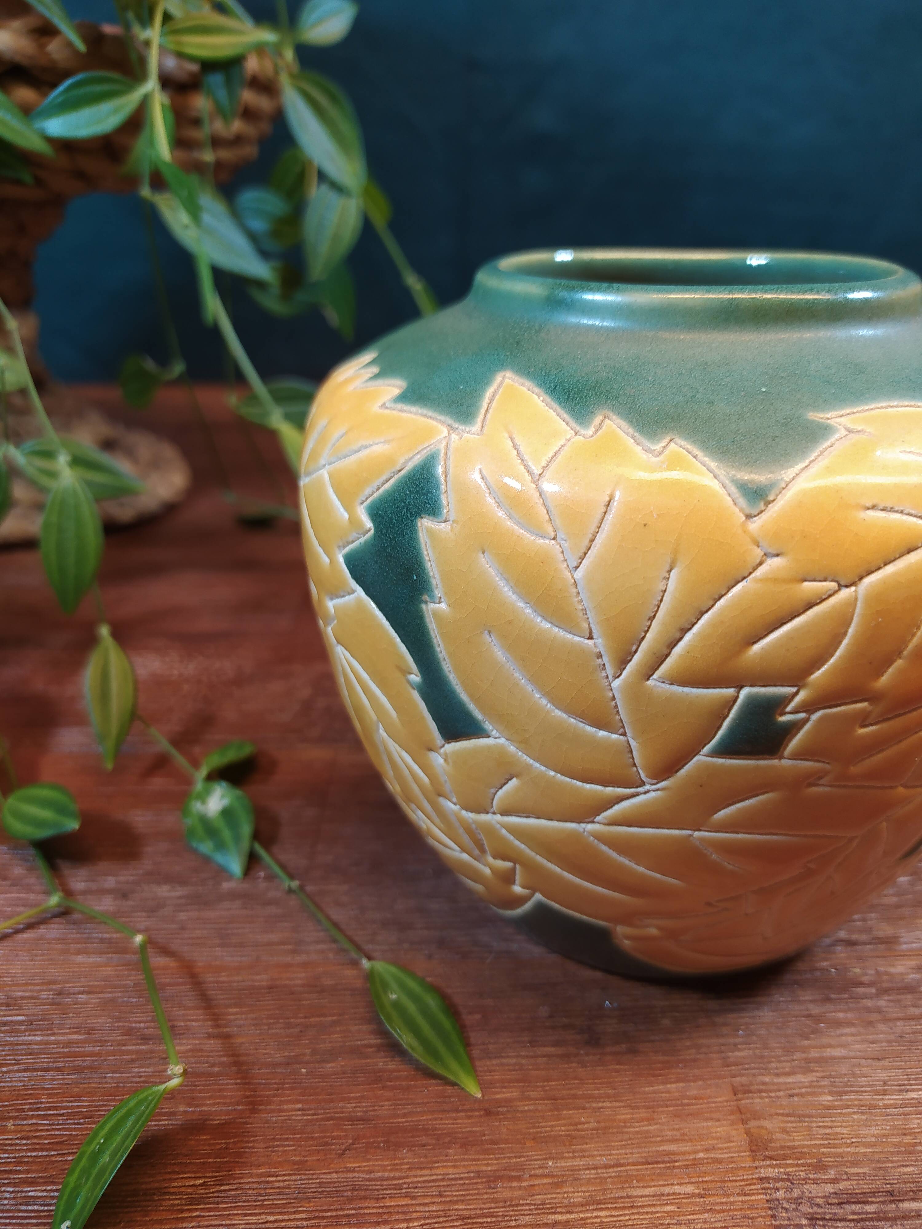 Ceramic ball vase with yellow and green leaf patterns