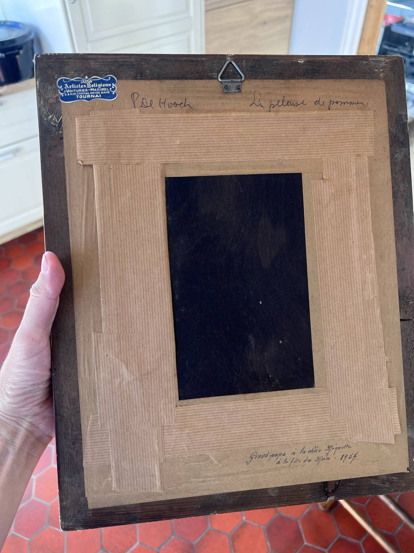 Framed reproduction painting with a golden frame.