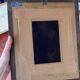 Framed reproduction painting with a golden frame.