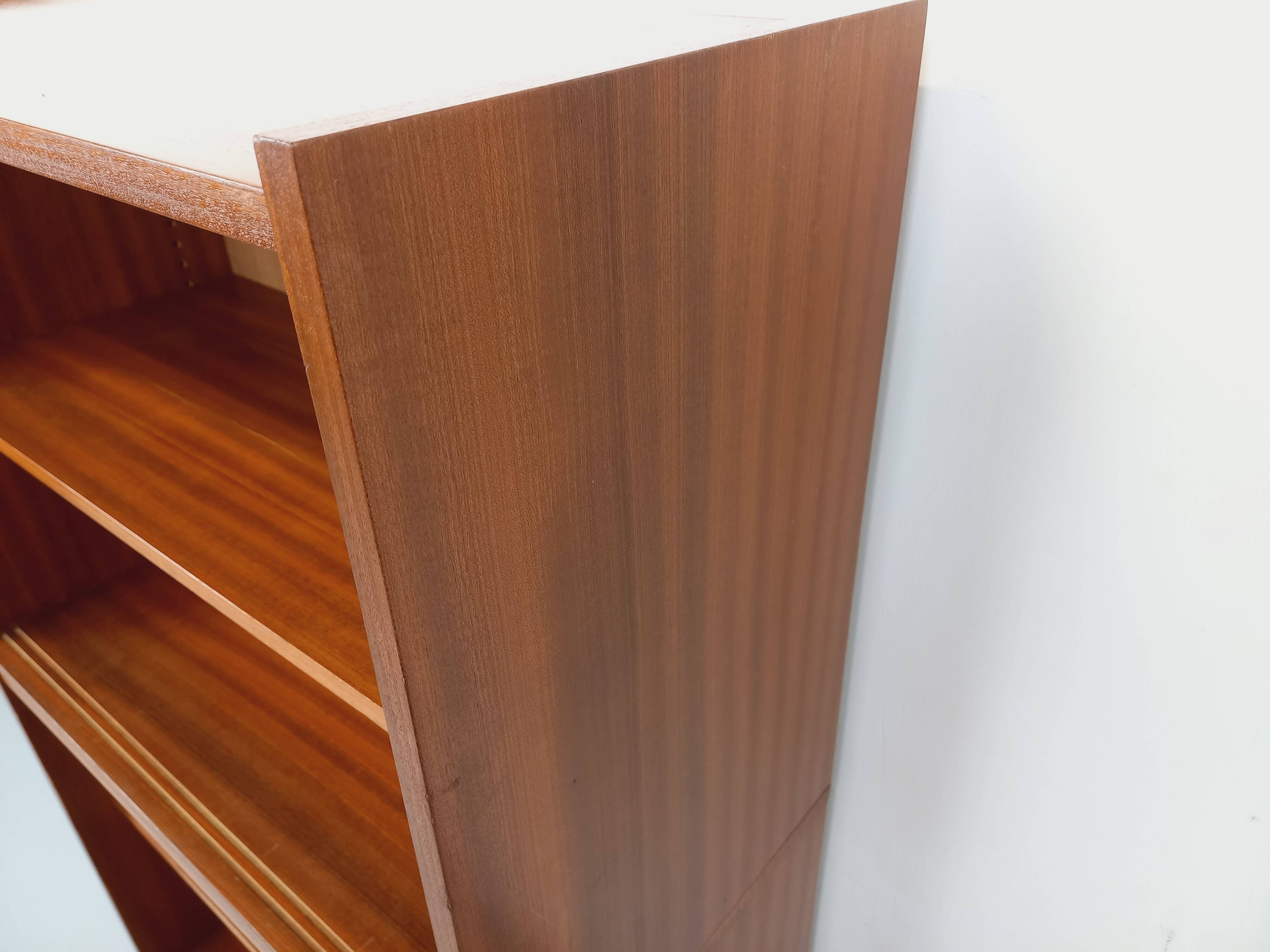 Vintage wooden bookshelf in teak style from the 1960s.