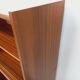 Vintage wooden bookshelf in teak style from the 1960s.