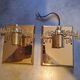 Pair of wall lights with hanging glass pendants in gold color