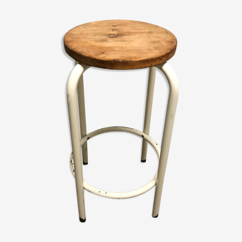 Vintage bar stool in white lace-up, round wooden seat rests circular feet