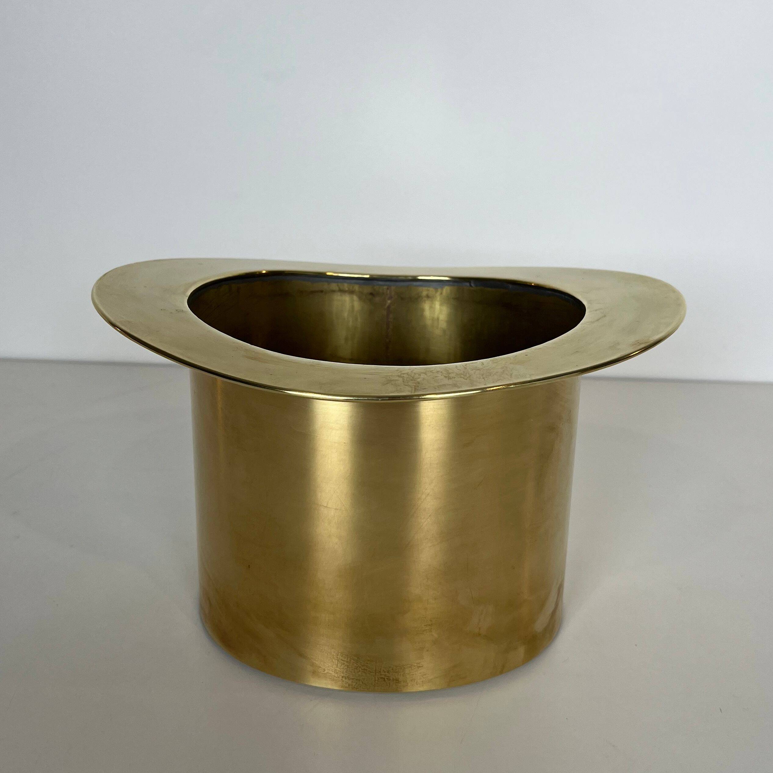 Champagne cooler shaped like a brass top hat.