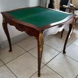 Console transforming into a 19th century Louis XV style gaming table