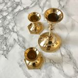 Set of three candlesticks in brass