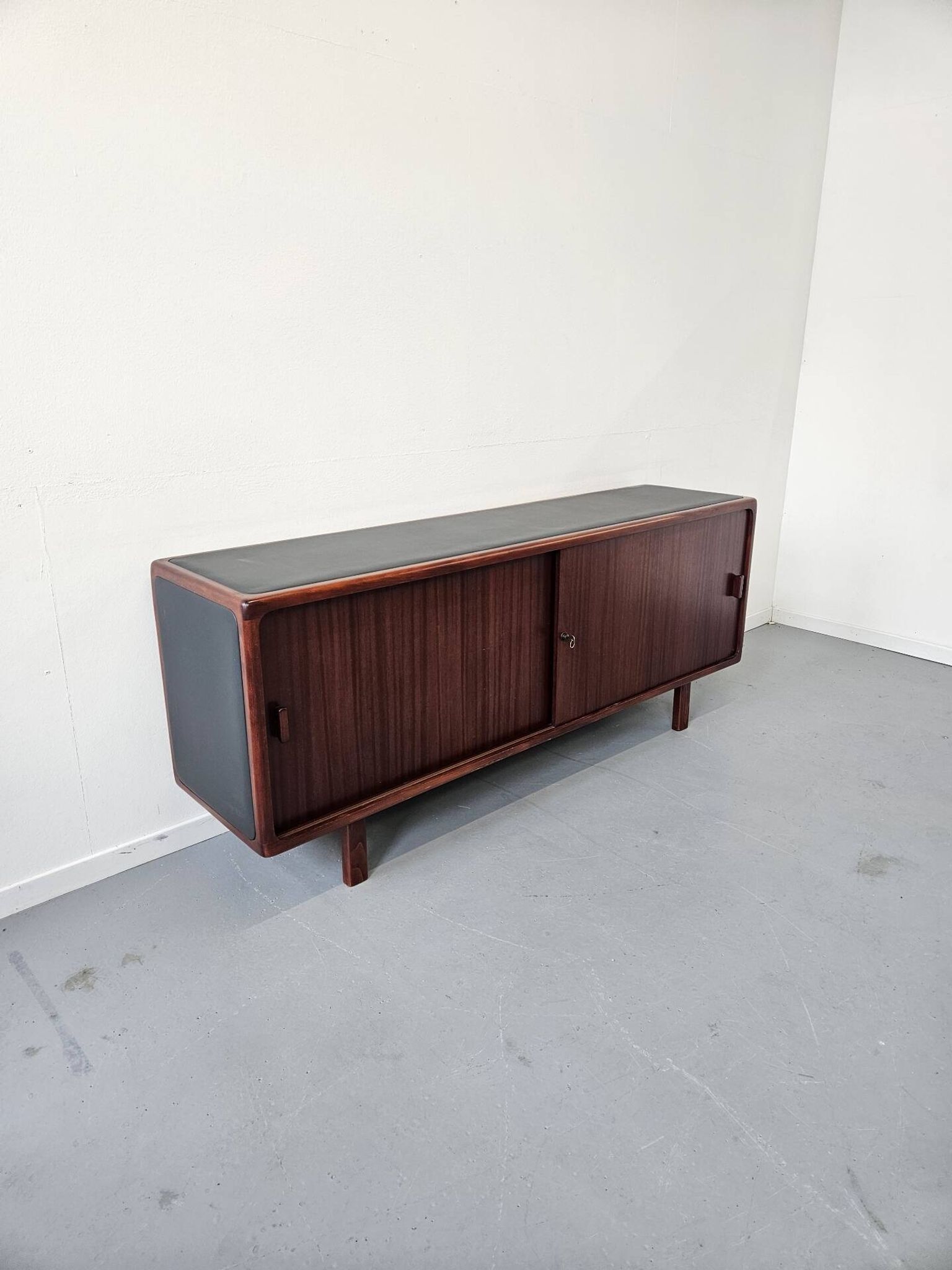 Vintage enfilade in teak and leather, 1970s.