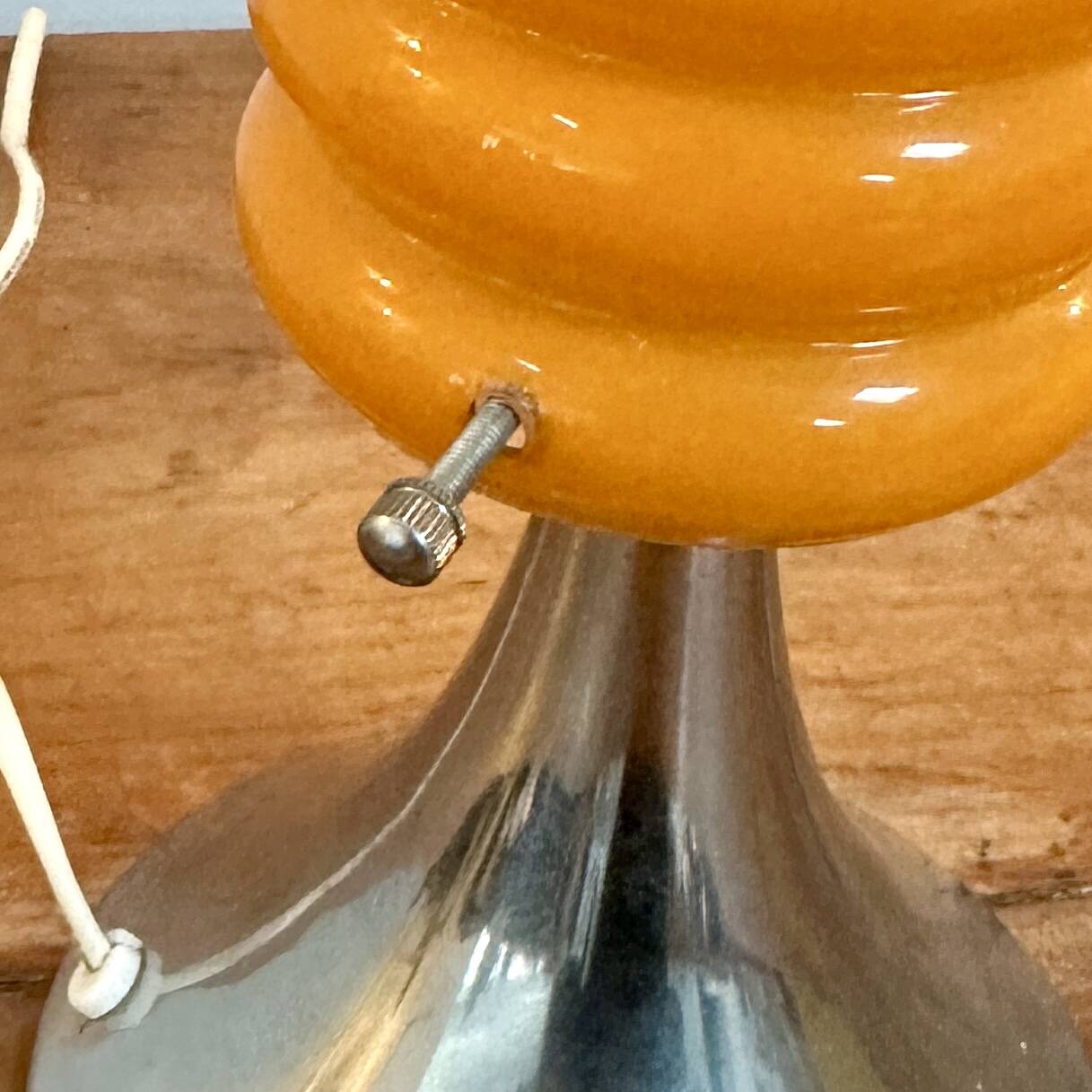 Vintage orange lamp with chrome tulip base and glass shade