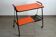 Vintage perforated orange metal dessert table