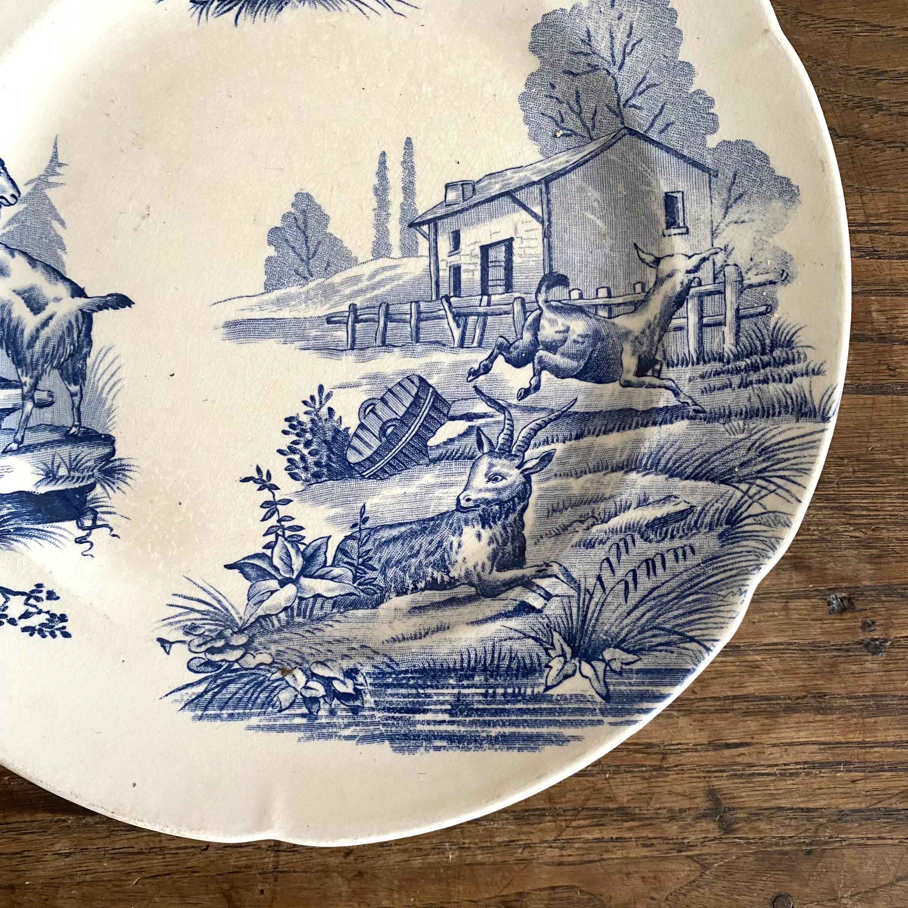 "Rustic" iron earth plate with goats