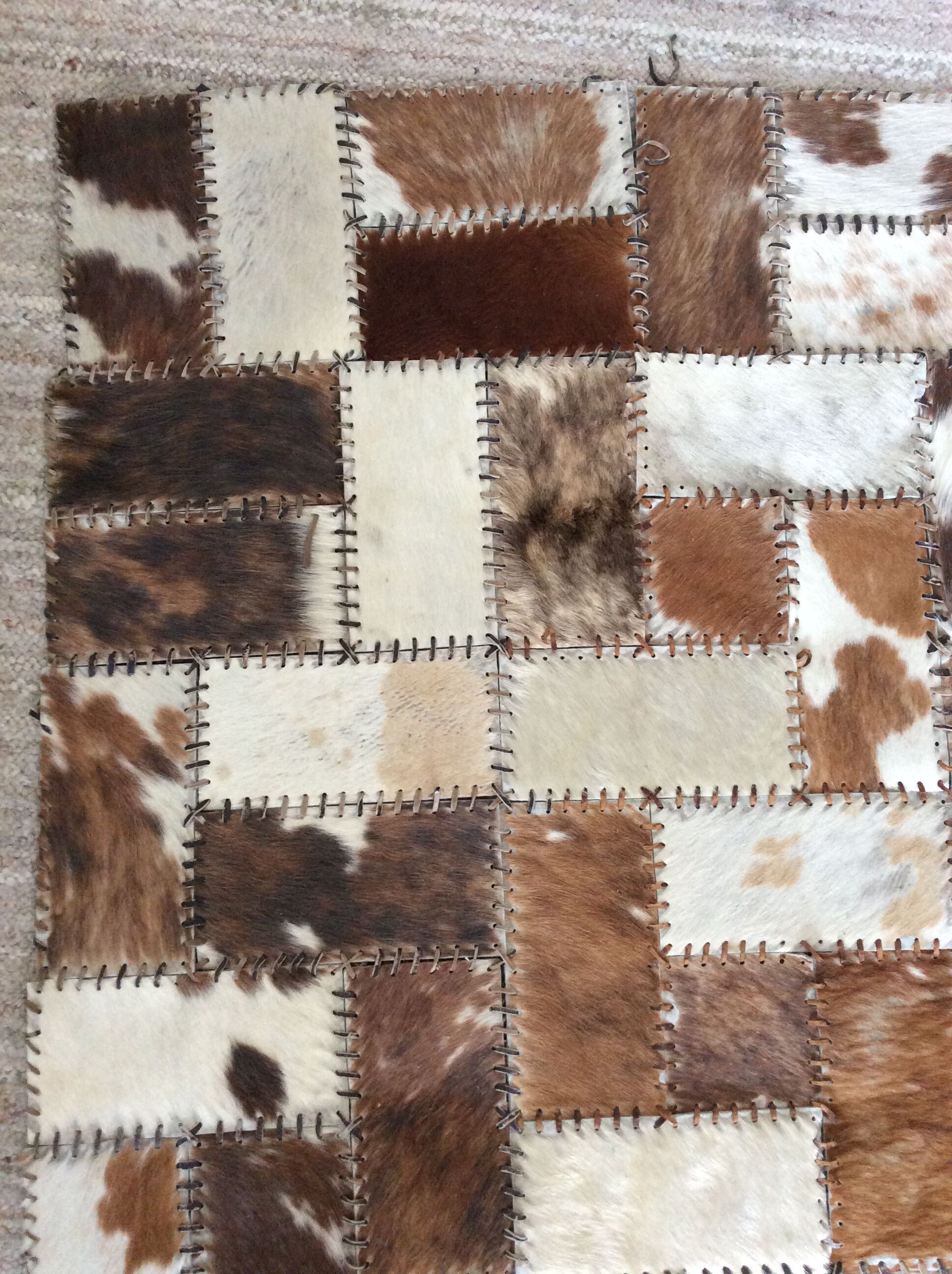Patchwork carpet in cowhide 164x105cm from the 70s