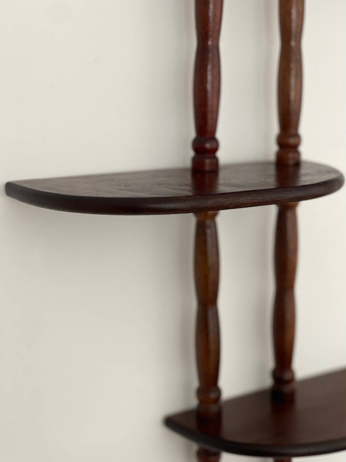 Turned wood wall shelf