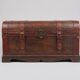 Wooden trunk with leather and metal, ultra chic and elegant in a living room or bedroom.