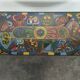 Chrome steel coffee table with zodiac signs decoration.