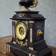 Large notary clock in black marble and gilded bronze.