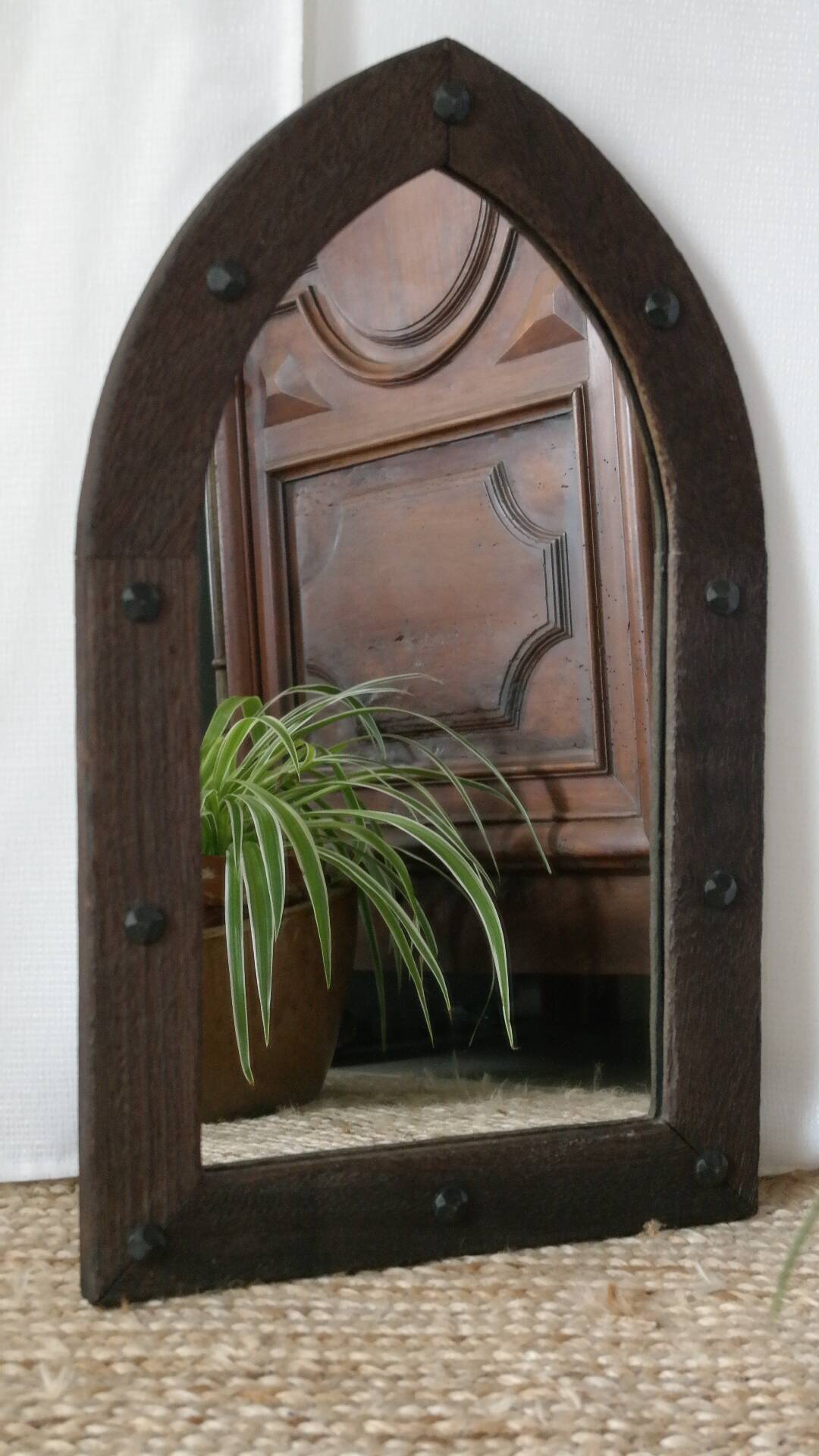 Old handcrafted Gothic style wooden mirror