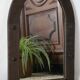 Old handcrafted Gothic style wooden mirror