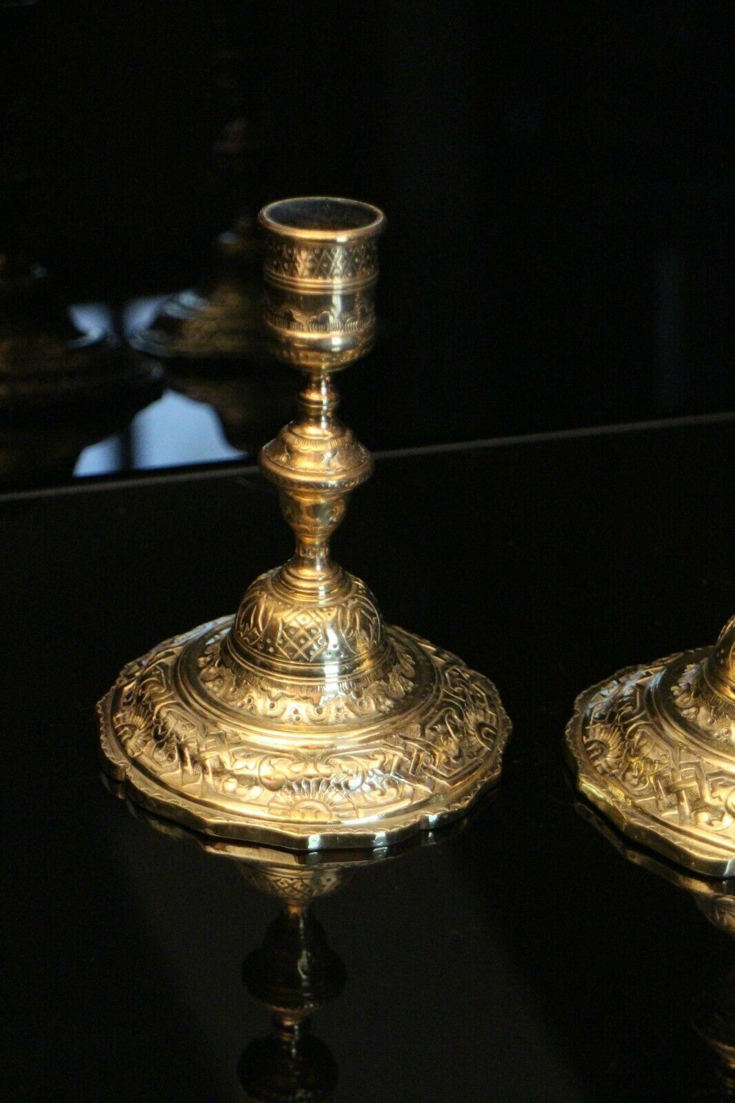 Pair of 19th bronze candlesticks with Regency-style chiseled decoration