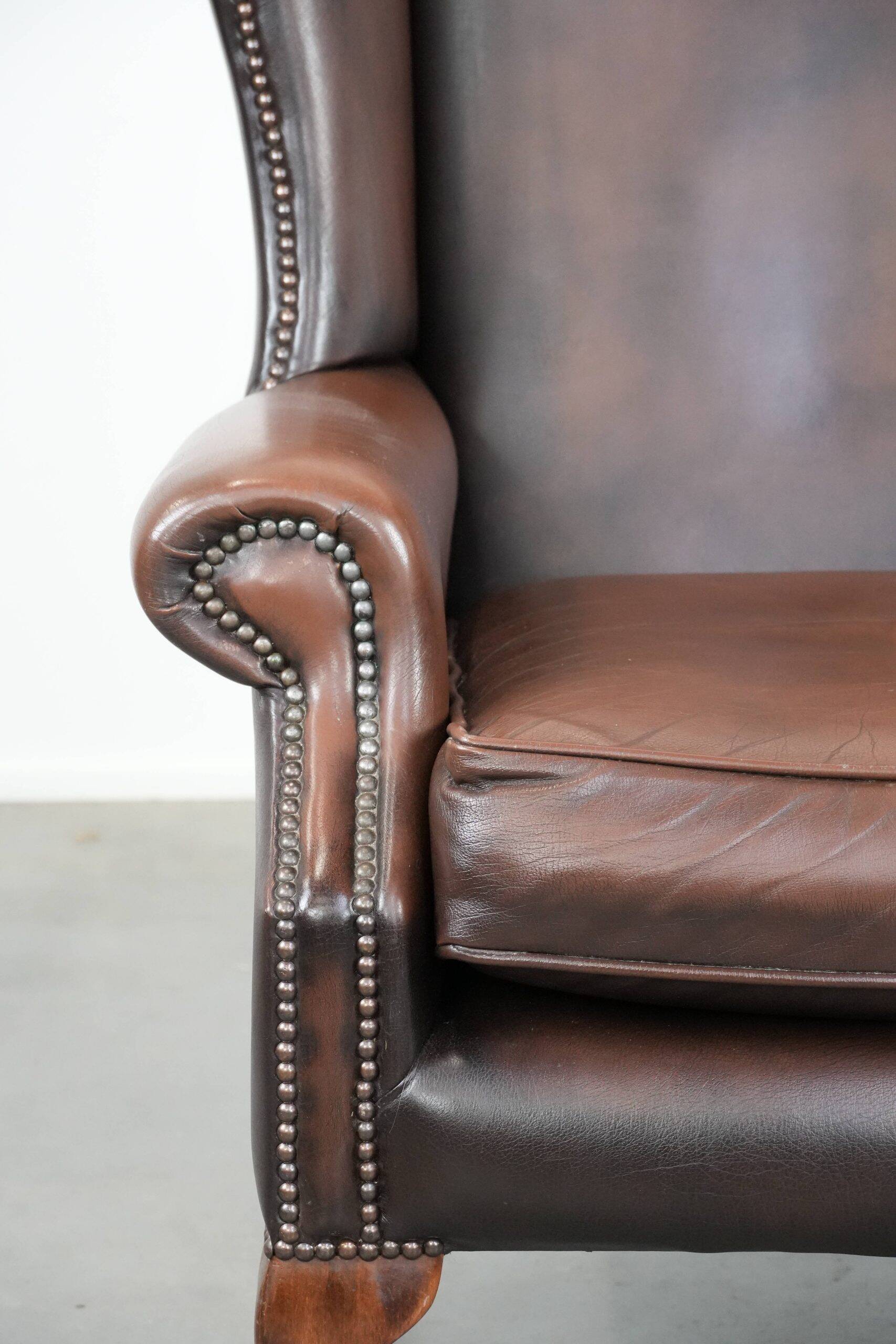 Brown smooth cow leather Chesterfield wingback armchair in English style