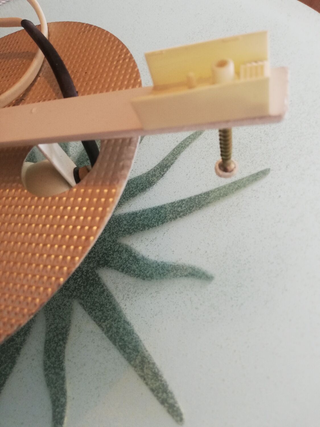 White opaque glass ceiling light and golden metal sun