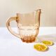 Pitcher and 6 water glasses in pink glass