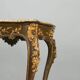 Baroque-style table in carved wood