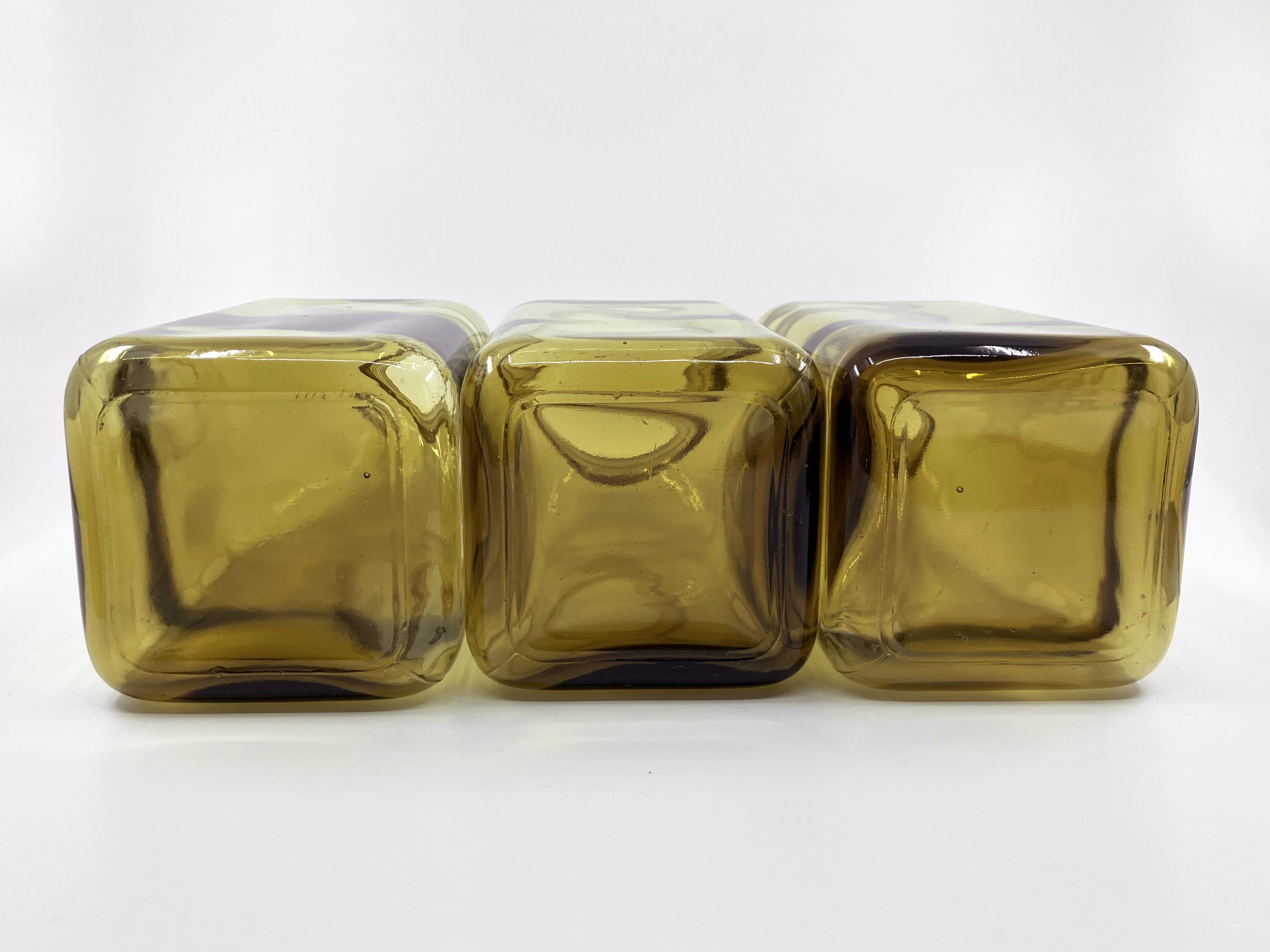 3 molded amber glass pharmacy bottles • Bakelite stoppers • 1950