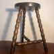 Round tripod stool with turned wooden legs