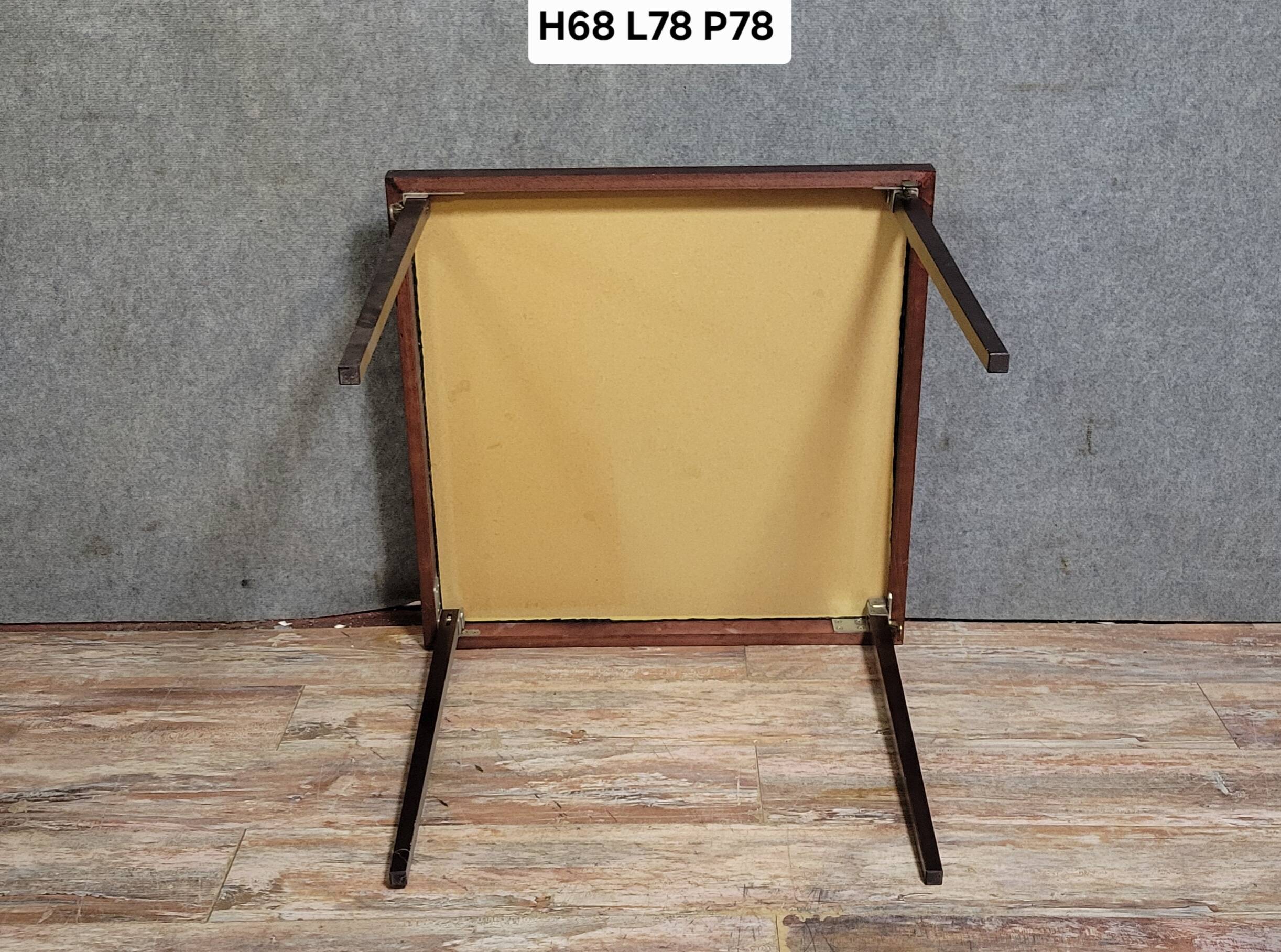 a wooden Bridge game table resting on four thin, straight legs