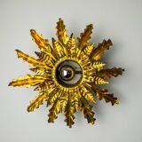 Brutalist sun wall lamp, metal and gold leaf, Italy, 1960