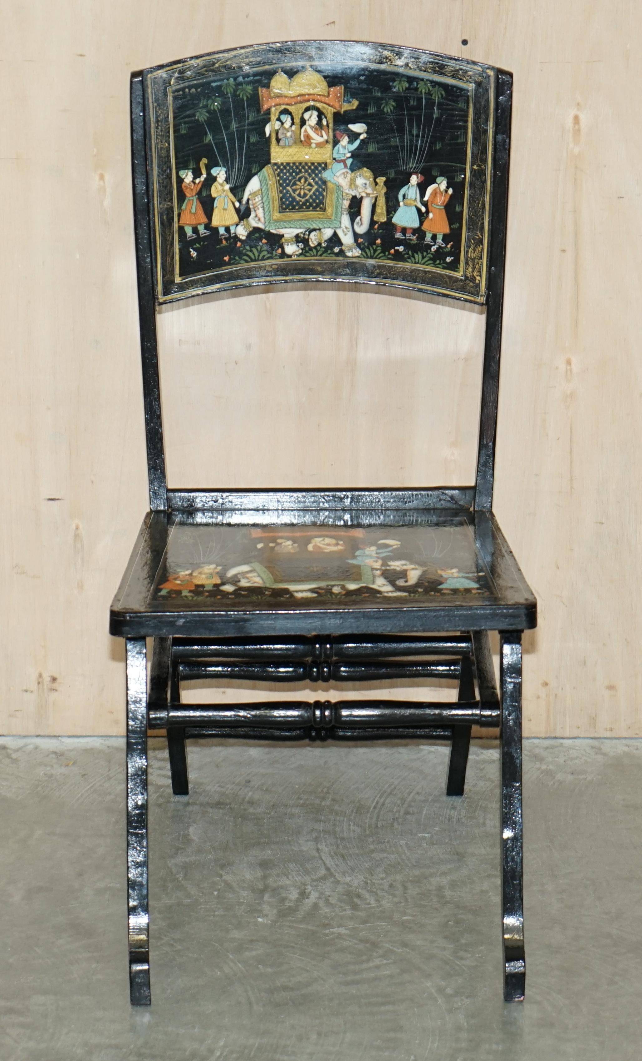 Pair of military folding chairs with Indian decoration.