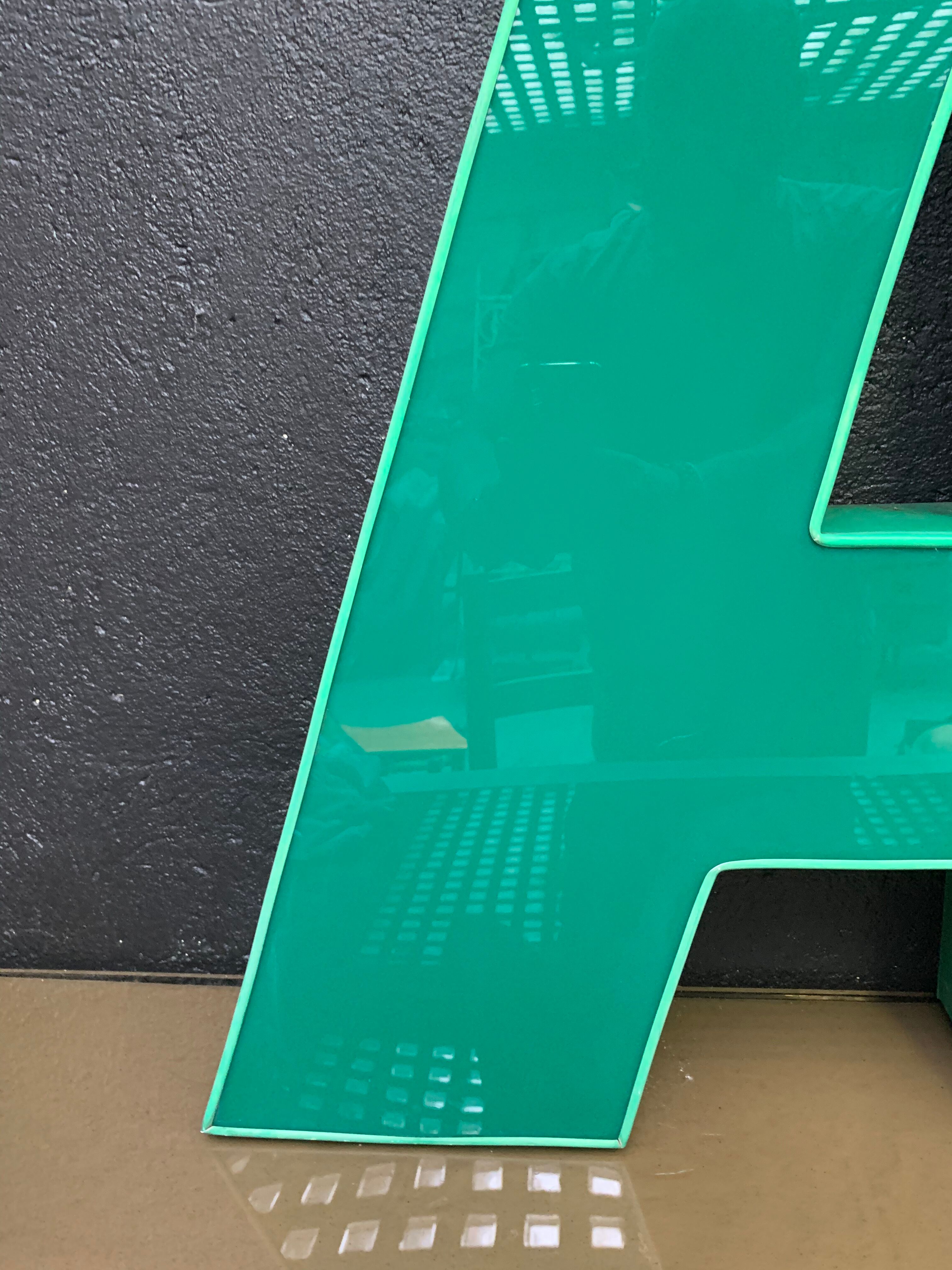 Old letter in metal and plexiglass, industrial decoration