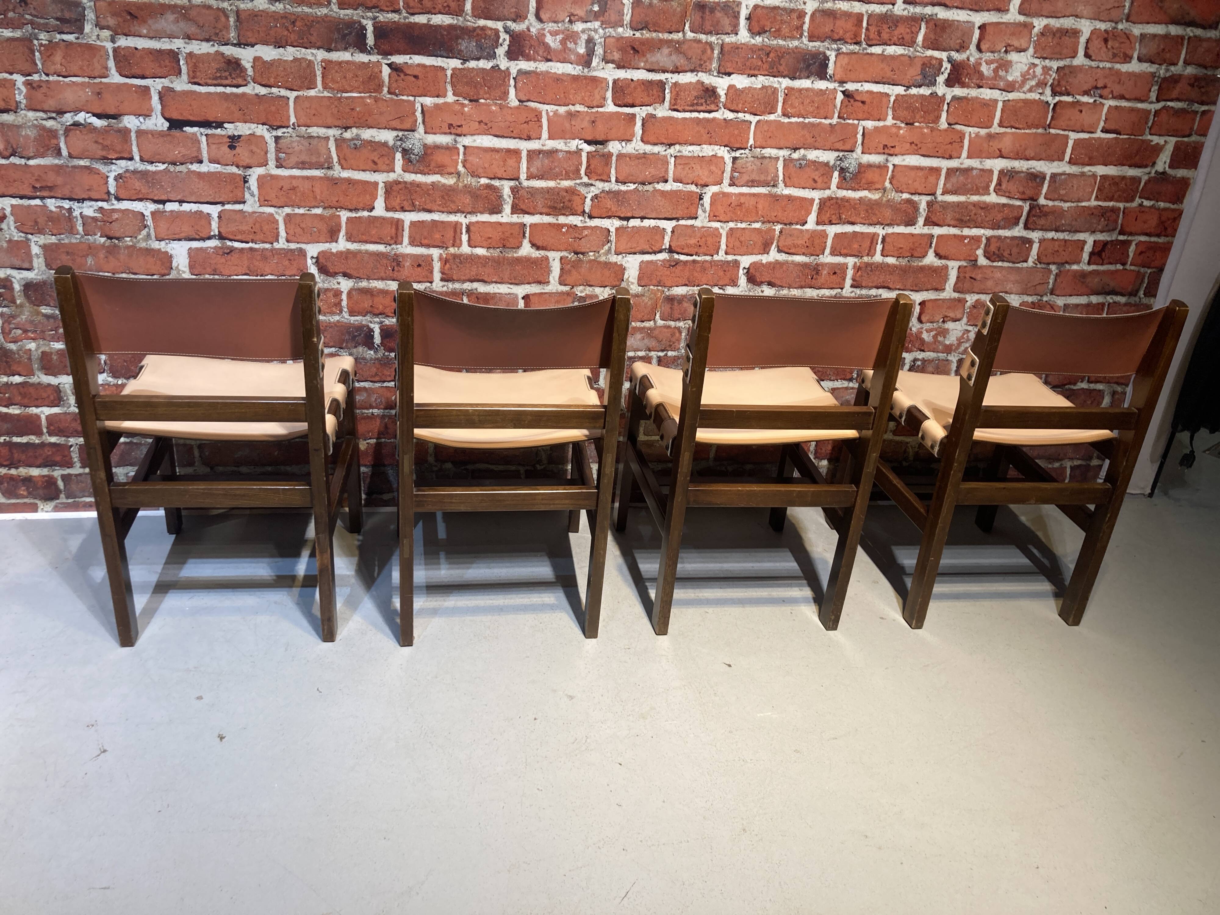 Set of four wooden and leather chairs from Maison Regain