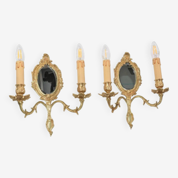 Pair of Louis XV style beveled mirror sconces in bronze by Lucien Gau