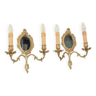 Pair of Louis XV style beveled mirror sconces in bronze by Lucien Gau
