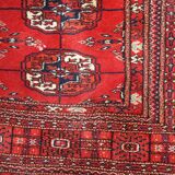 Tapis vintage fait main Tekke en laine rouge (109cm x 112cm) – Années 1970