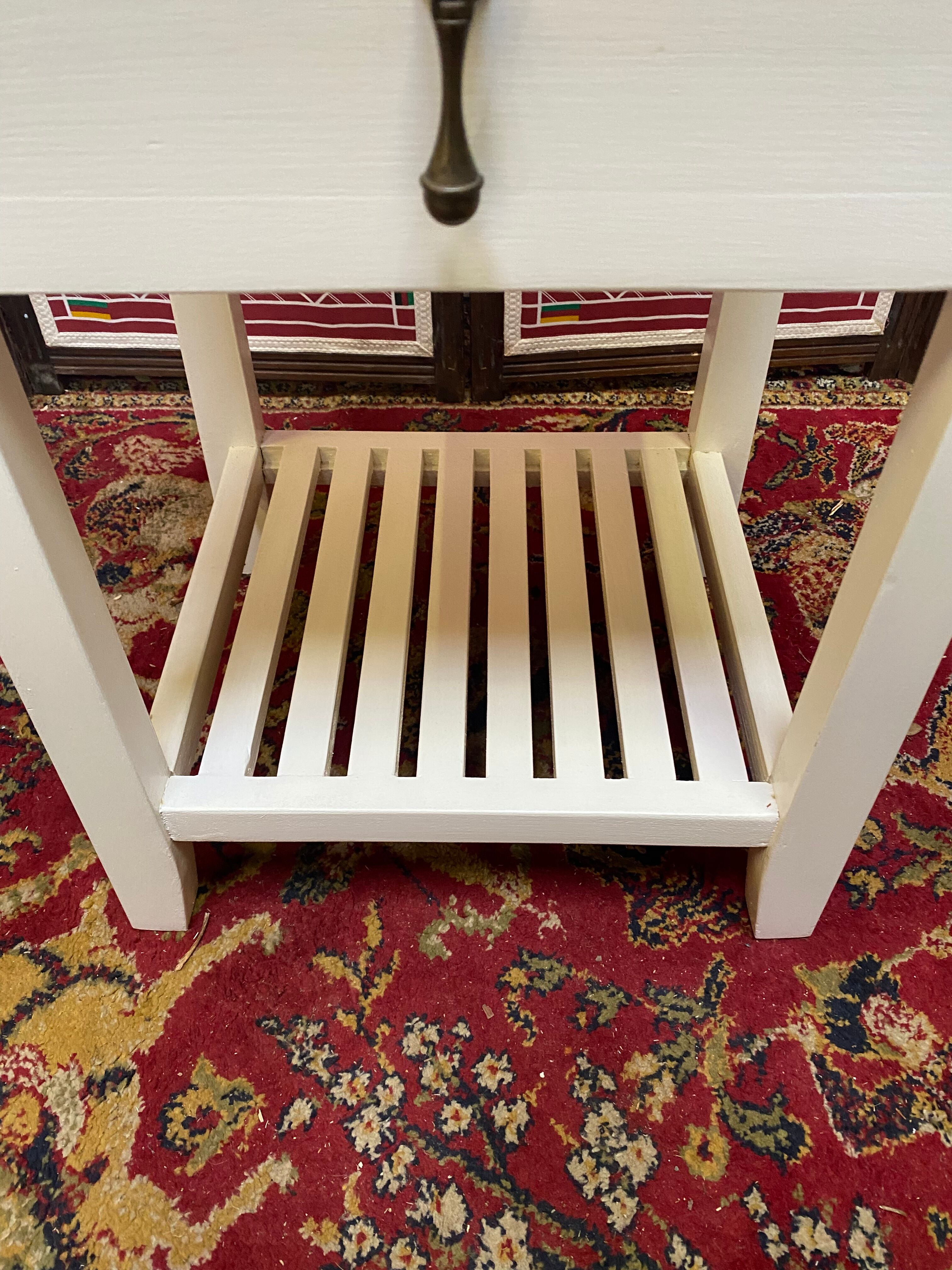 Wooden bedside table painted white