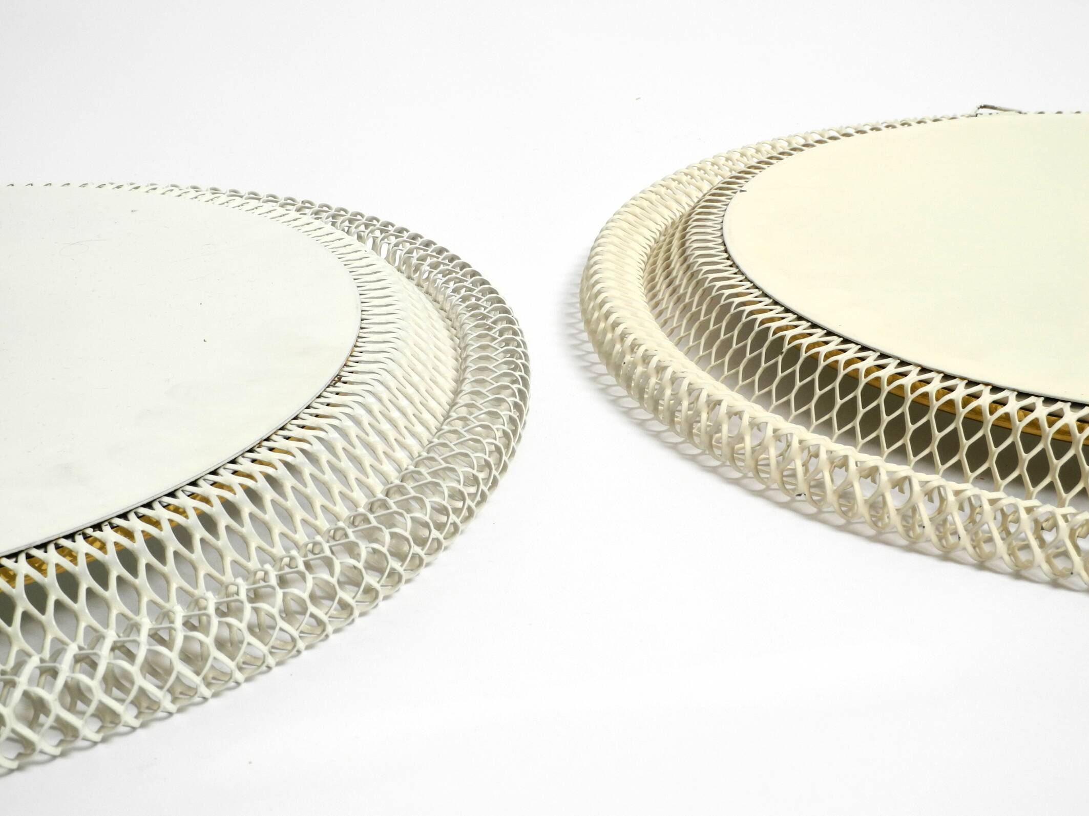 Pair of Mid Century wall mirrors with brass rim and white metal frames