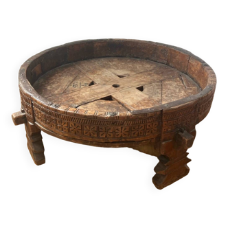 Round coffee table in old carved wood