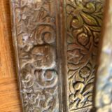 Cellar rat candlestick in gilded brass chised flower pattern, foliage and old face