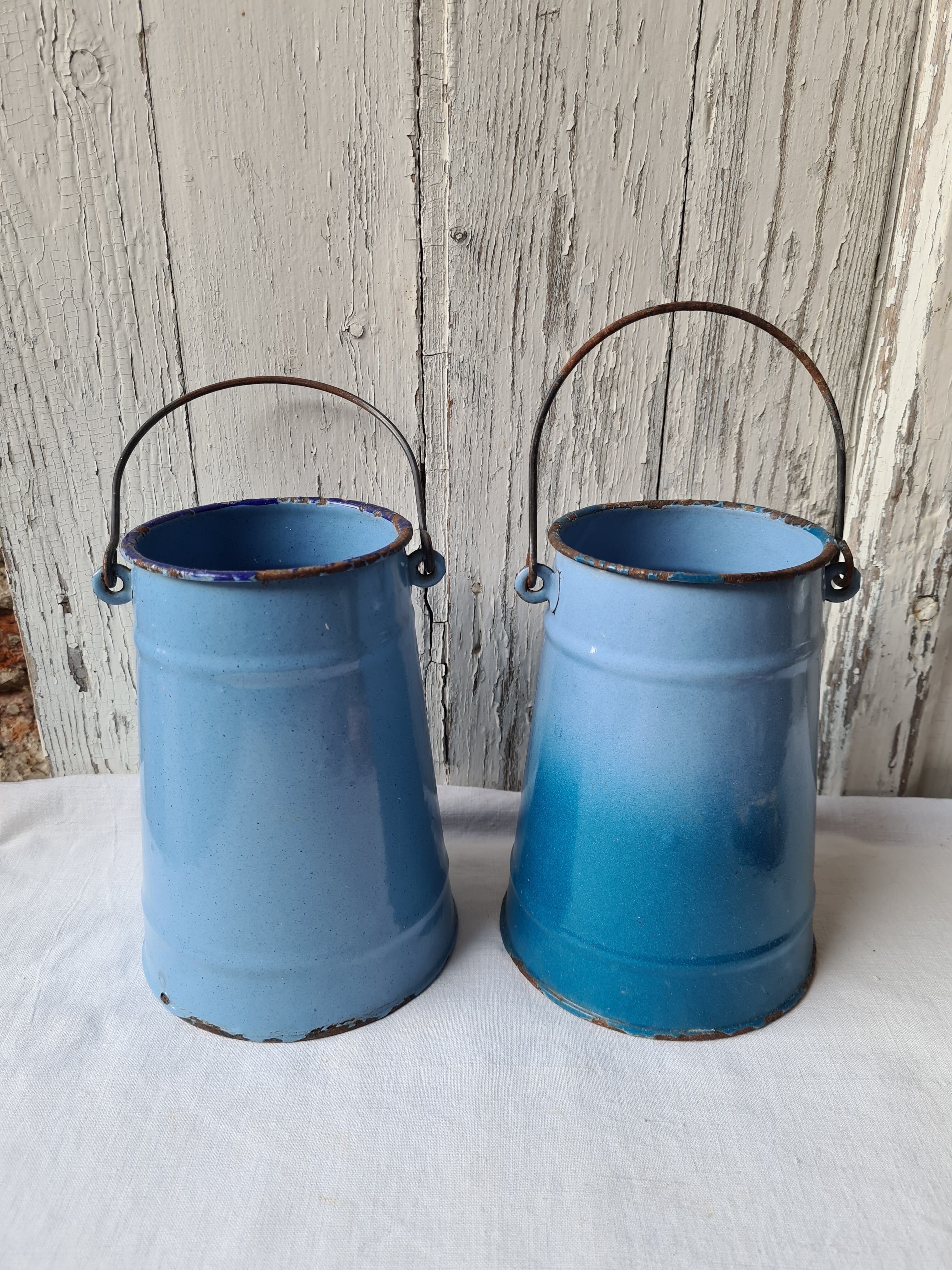 Two enamelled milk jars