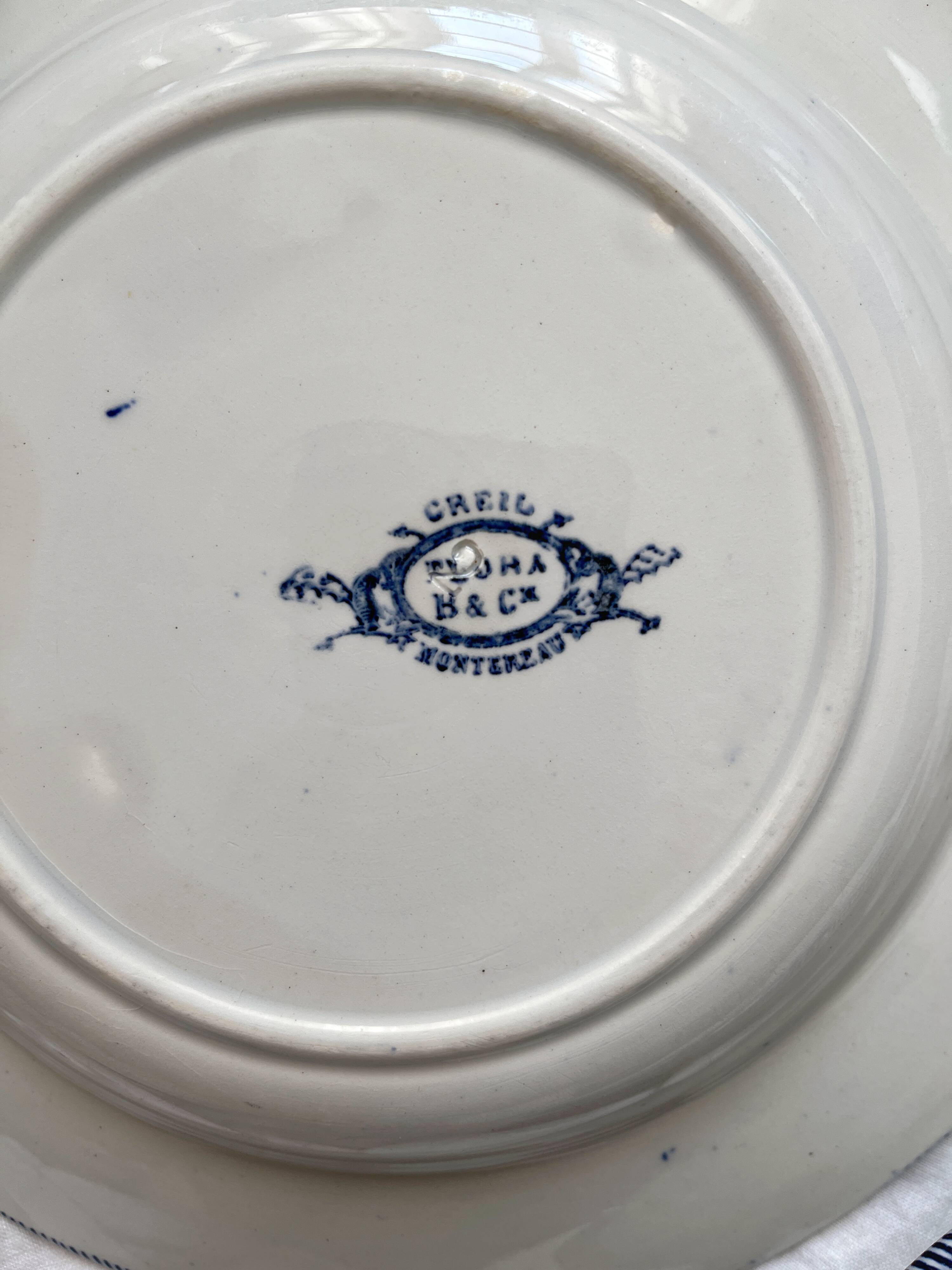 Three Flora ironstone soup plates, Creil and Montereau, late 19th century