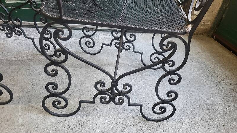Pair of black wrought iron armchairs