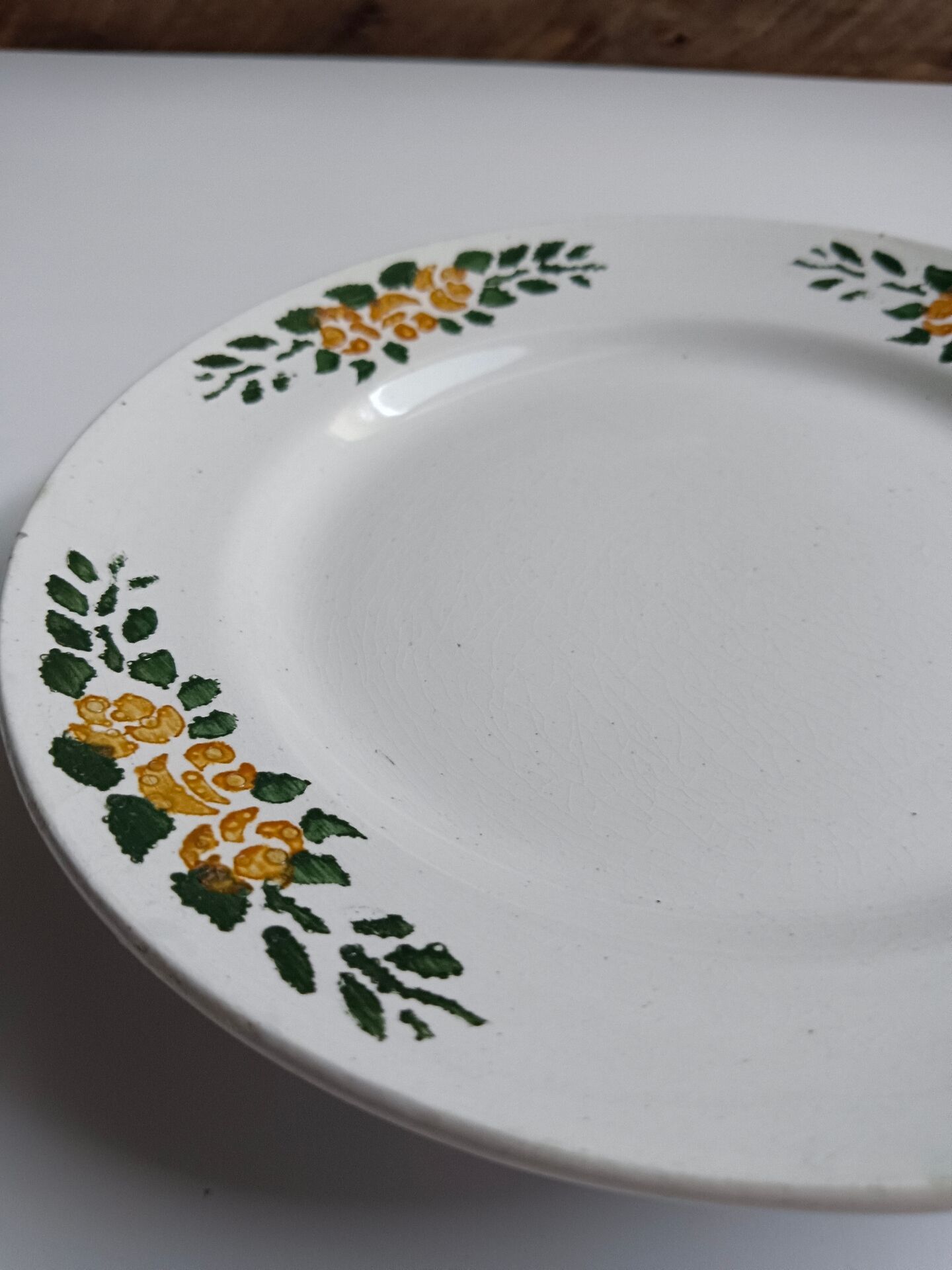 Old round footed plate signed Labrut brothers flowers