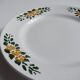 Old round footed plate signed Labrut brothers flowers