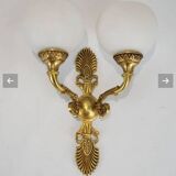 Paire d'appliques de style Empire en bronze doré et ciselé