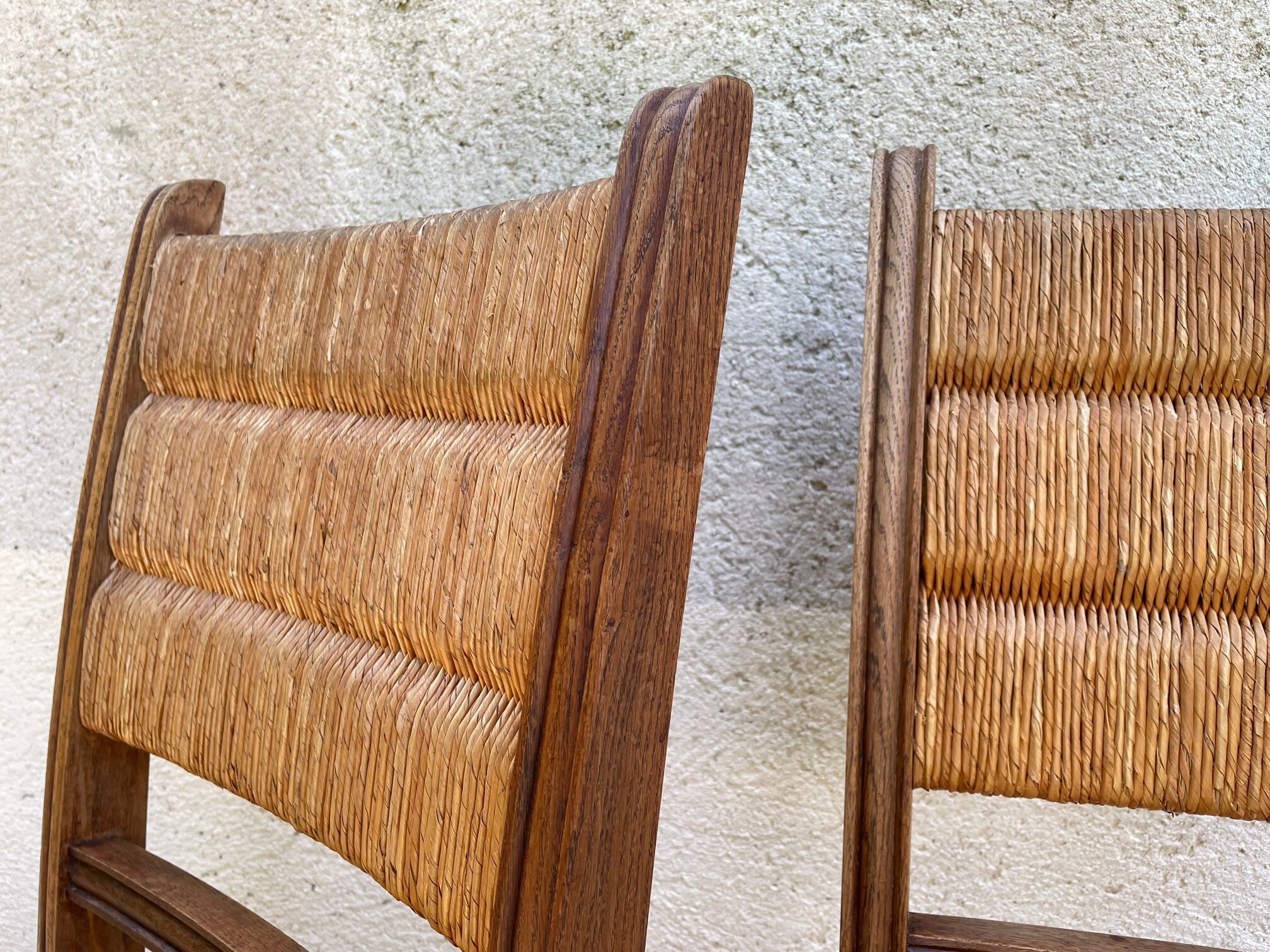 Pair of straw and solid oak chairs
